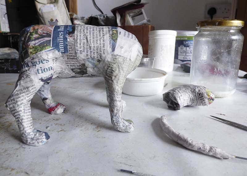 pieces of a papier mâché dog