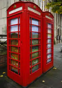 2 phone boxes with artwork in the windows