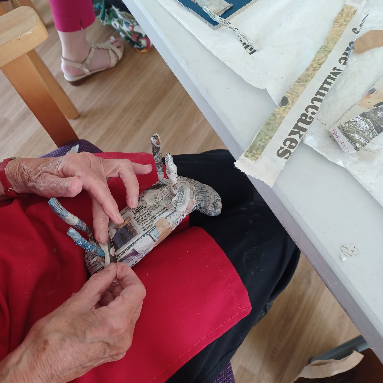 A woman modelling papier mache