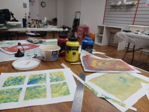 A selection of monoprints and materials